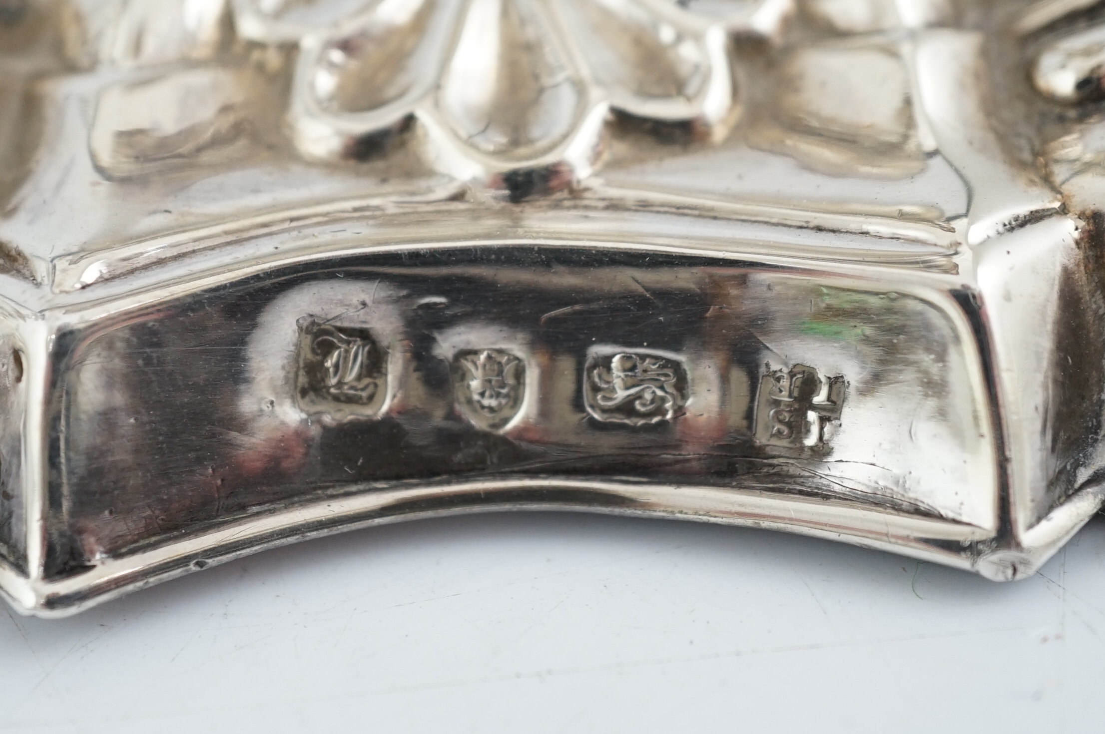 A pair of early George III silver candlesticks, by James Stamp & John Baker